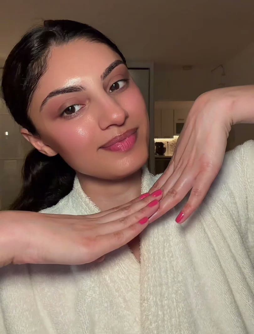 Sarina smiling mid skincare routine